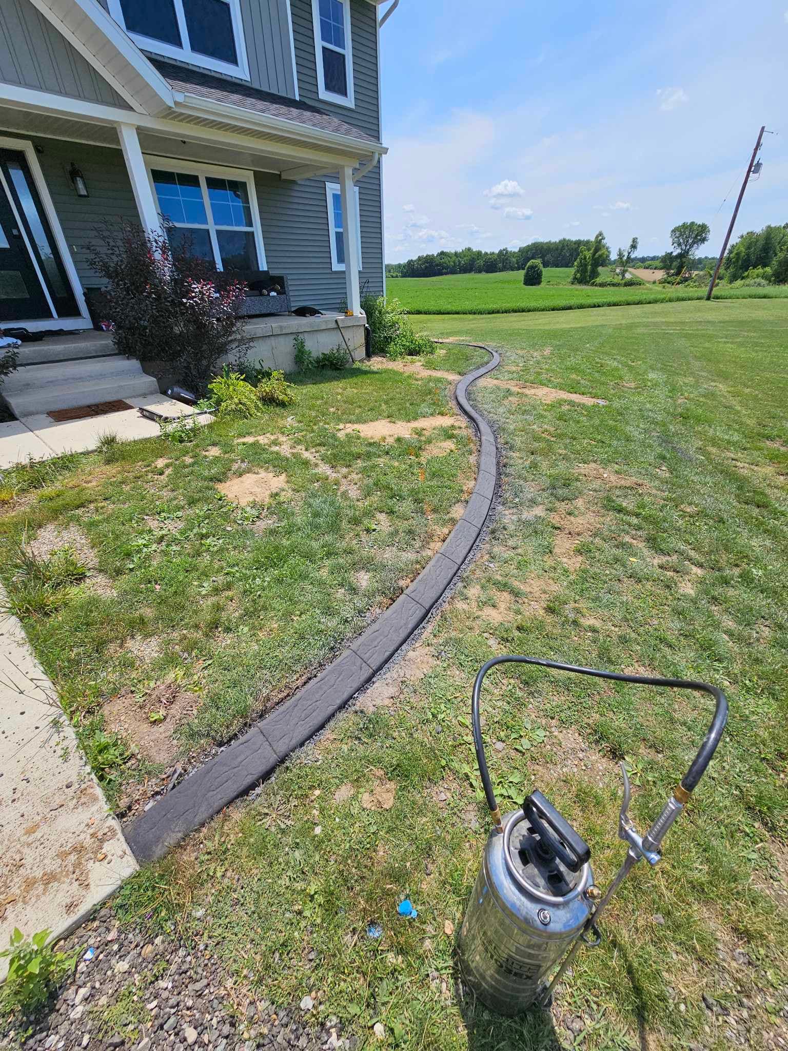 Decorative entrance curbing with landscaping
